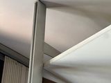 a picture of a ceiling with a white sheet hanging from the ceiling