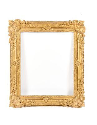 an antique gold frame on a white background
