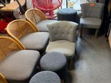 several chairs and stools are lined up in a room