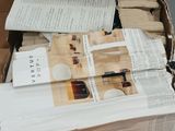 a cardboard box with a bunch of papers inside of it