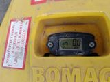 a yellow fire hydrant that has a digital clock on it