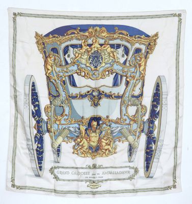 a blue and white scarf with a picture of a horse and carriage
