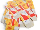 a pile of yellow and red tickets sitting on top of each other