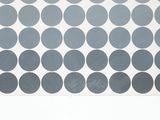 a black and white picture of a pattern of circles on a sheet of paper
