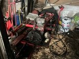 an image of a man working on a machine in a garage
