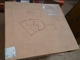 a cardboard box with a drawing of a fish on it