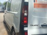 a white van that is parked in a parking lot
