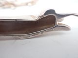 a silver object that is sitting on a table