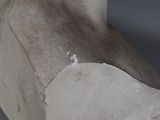 a close up of a sculpture of a bird on a table
