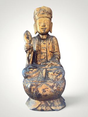 an image of a statue of a person sitting on a lotus