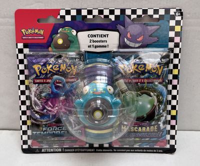 a box of pokemon toys on a white surface