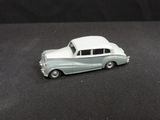 a toy car that is sitting on a black surface