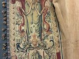 a picture of a tapestry with a woman on it