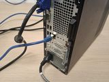 a computer with wires connected to it on a table