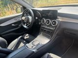 the interior of a car with a steering wheel, dashboard, and dashboard controls