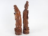 pair of chinese carved wood figures of a man and a woman