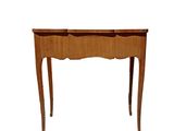an image of a small wooden table with drawers