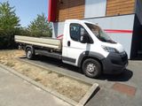 a white truck that is parked in front of a building