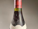 a bottle of wine that is sitting on a table