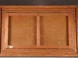an old wooden frame with a picture of a window in it
