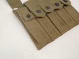 a close up of a belted pouch with buttons on it