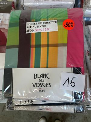 a pile of bedding that is on display in a store