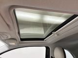 the interior of a car with a sunroof and a view of the roof