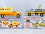 two toy trucks that are sitting on top of each other
