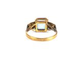 an image of a gold ring with a blue stone in the center
