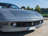 a silver sports car parked in a parking lot