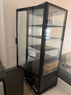 an image of a refrigerator with a glass door