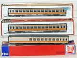 three model trains are stacked on top of each other on a table