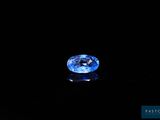 a blue sapphire gems on a black background