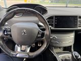 the interior of a car with a steering wheel and dashboard controls