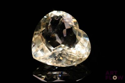 an image of a heart shaped diamond on a black surface