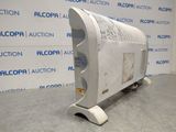a white air conditioner sitting on top of a floor next to a wall