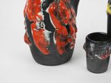 a black and red vase and a black and white vase