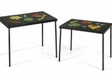 two small tables with flowers painted on them sitting side by side