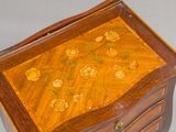 a small wooden table with a drawer on top of it