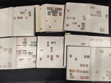 a lot of stamps on the pages of a book