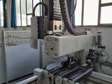 an image of a machine that is working on a piece of equipment