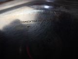 a close up of a metal bowl with a label on it