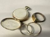 three silver rings and a silver ring with a picture on it