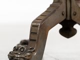 a close up of a metal object with a lion head on it