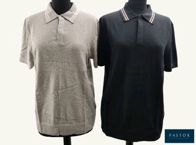 two women ' s polo shirts on a mannequin stand