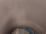 a trash can with a plastic bag inside of it