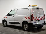 a white van with a red and white stripe on the back