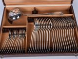 a wooden box with a set of silverware in it