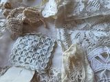 a lot of doily and laces on a table