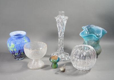 many different glass vases sitting on a table